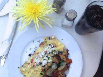 The 3 Sisters Omelet with corn, black beans, zucchini, mozz(arella), feta and spuds. Photo by Brooke Stobbe
