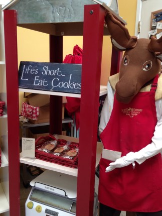 Cookies are sold in small bags of four, on display in red baskets. The mascot greets visitors when they first arrive. Photo by Brooke Stobbe